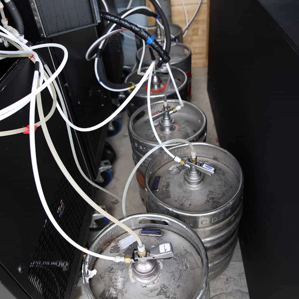A behind the scene photo, as six kegs serve three mobile EBar units